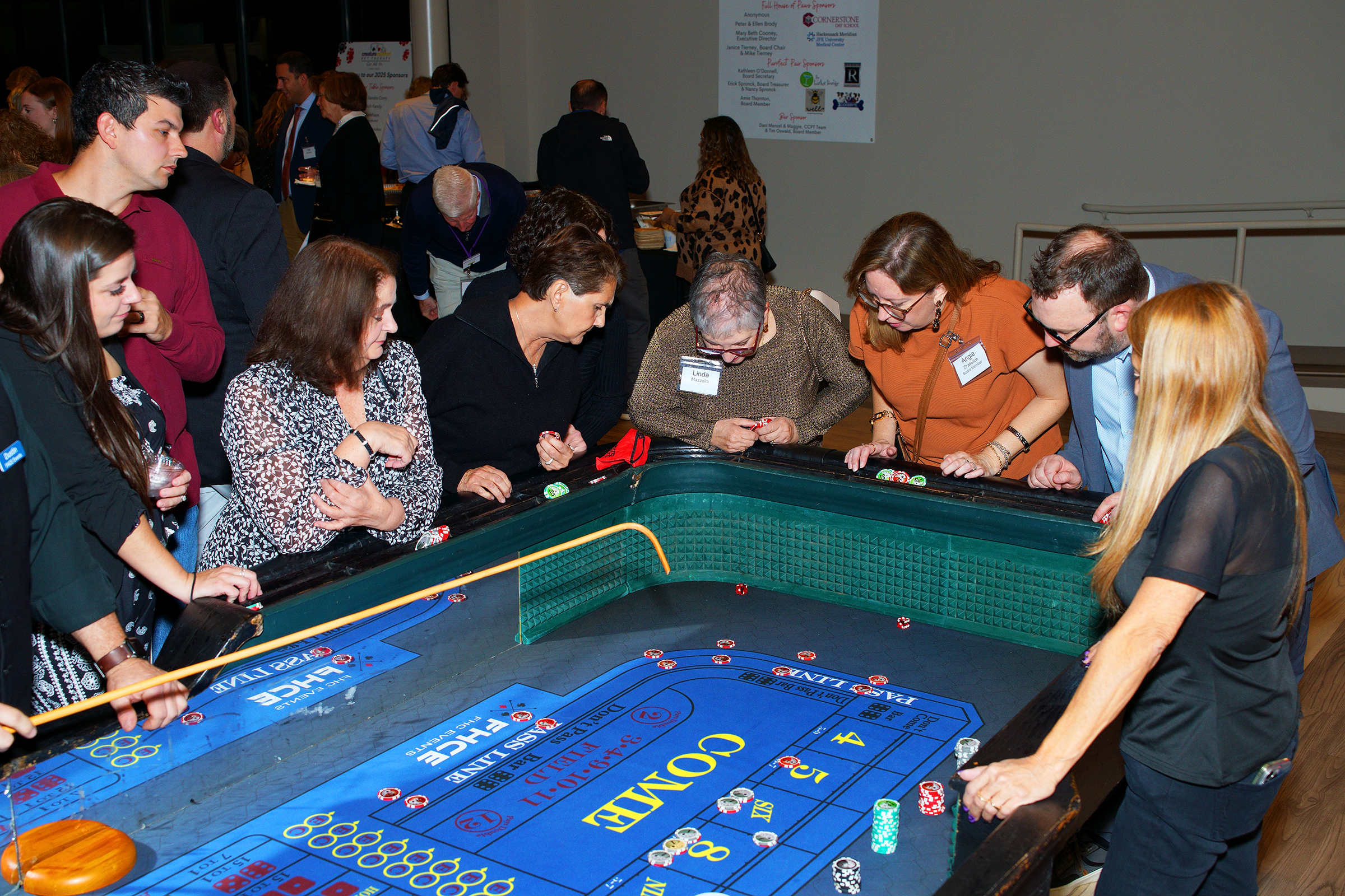 Attendees at Casino Night playing games